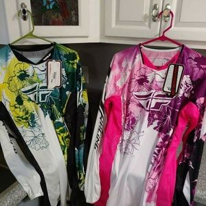 Two NWT women's motocross shirts.